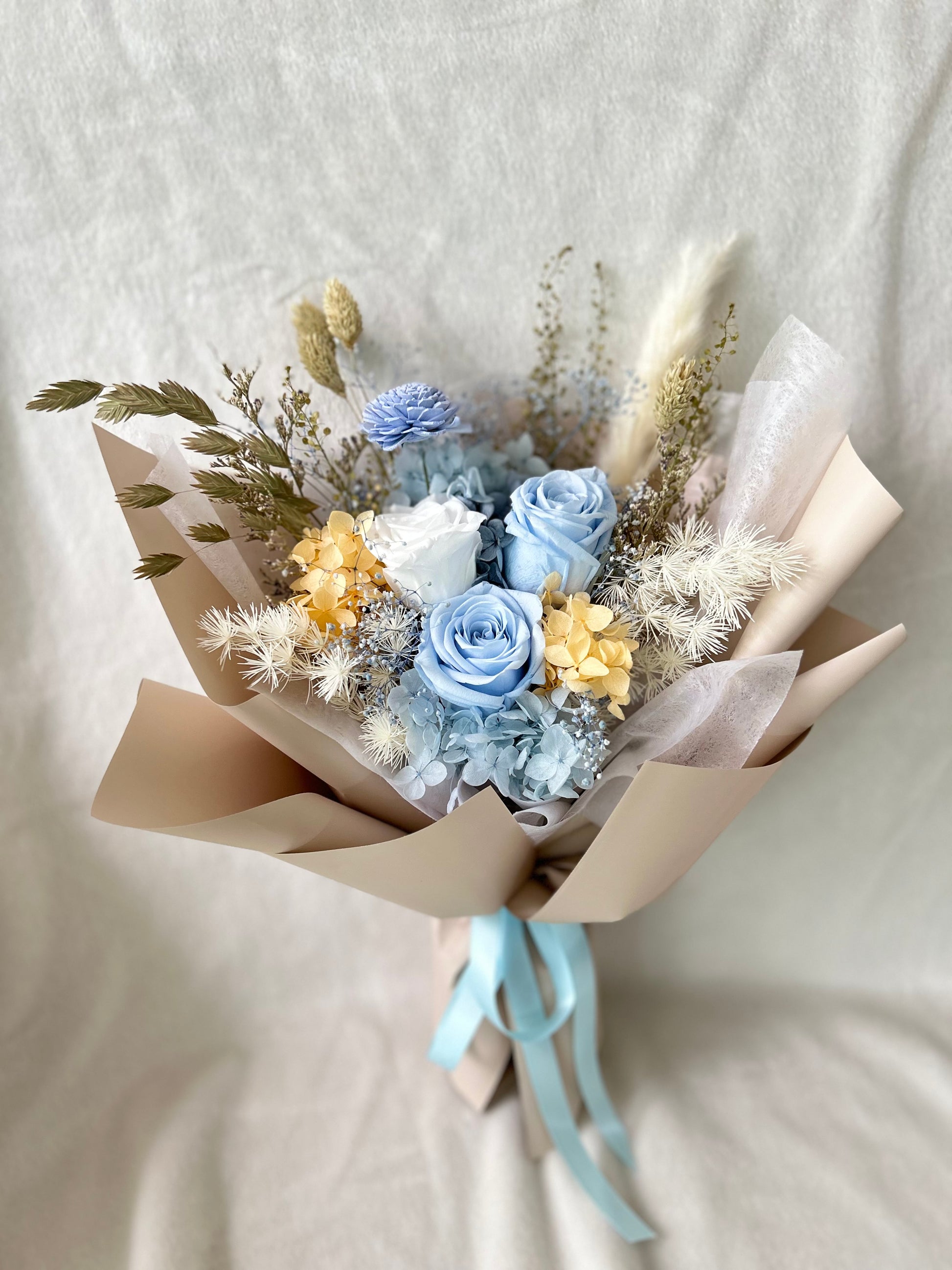 Pastel blue preserved roses bouquet