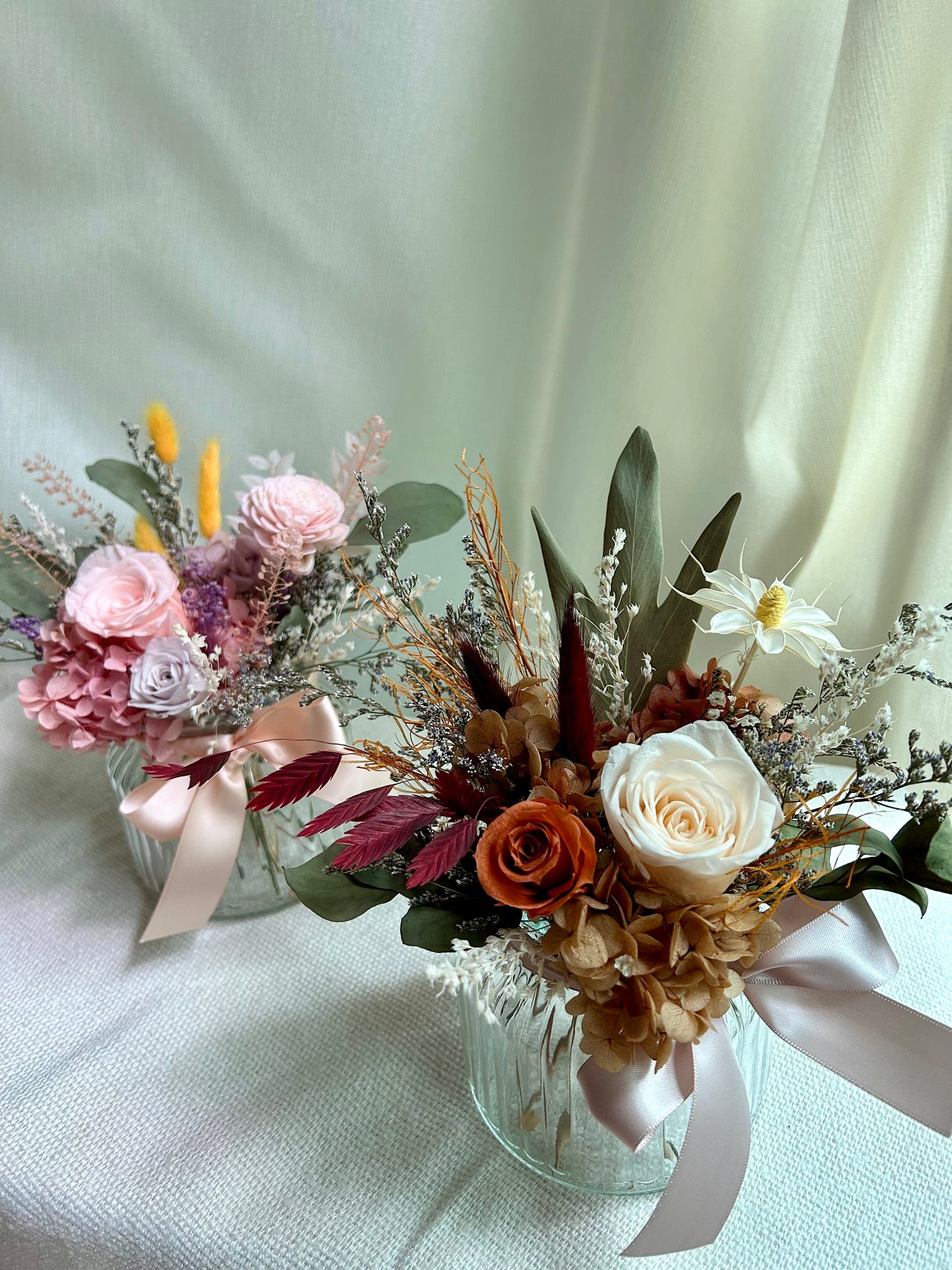 Preserved roses in vase arrangement pink and orange colours